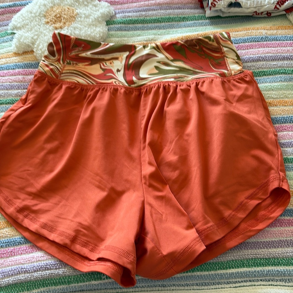 Orange shorts with designed waist band